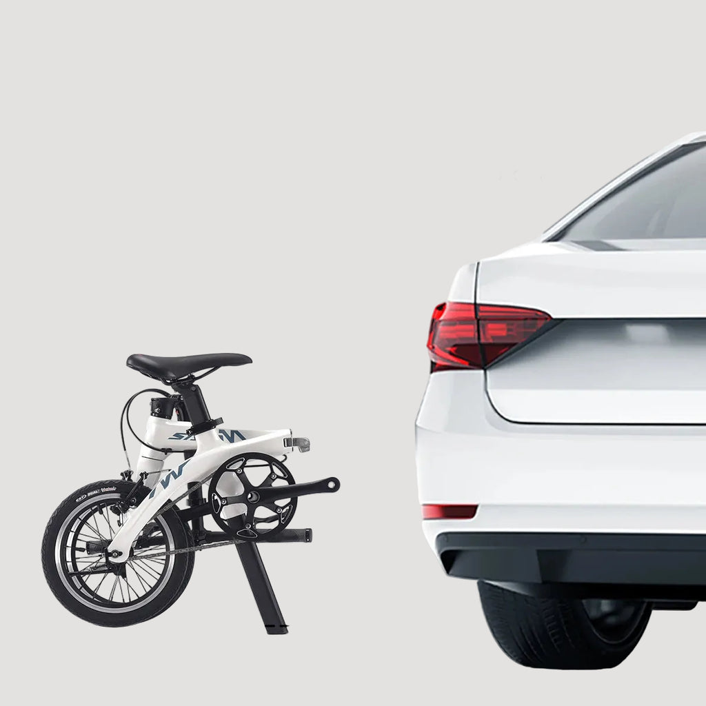 Foldable bicycle next to a car with text indicating ease of folding and storage.