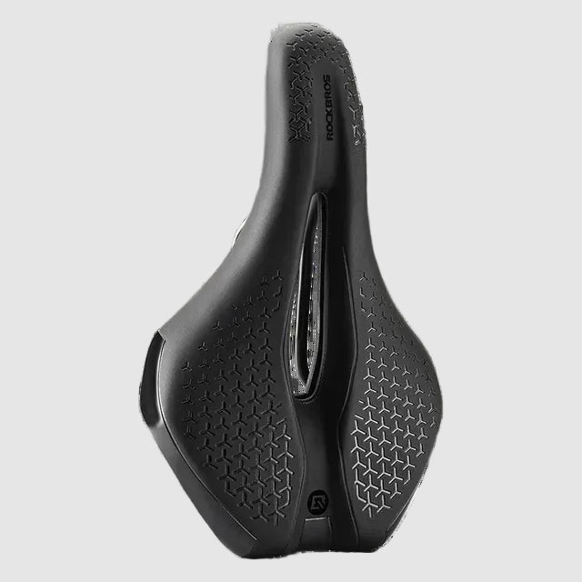 Black bicycle saddle with textured surface on a white background