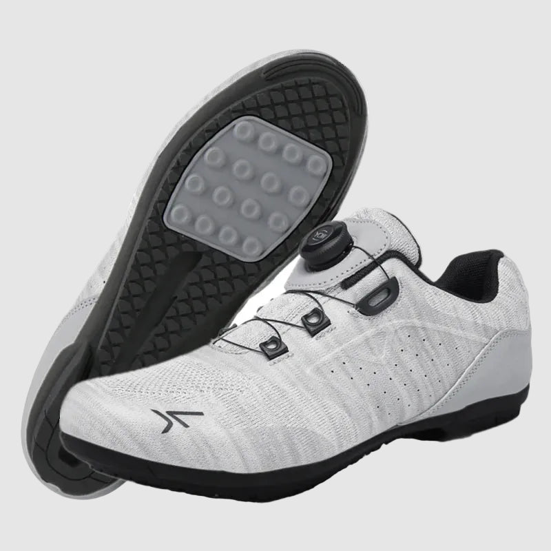 White cycling shoes with black soles on a white background