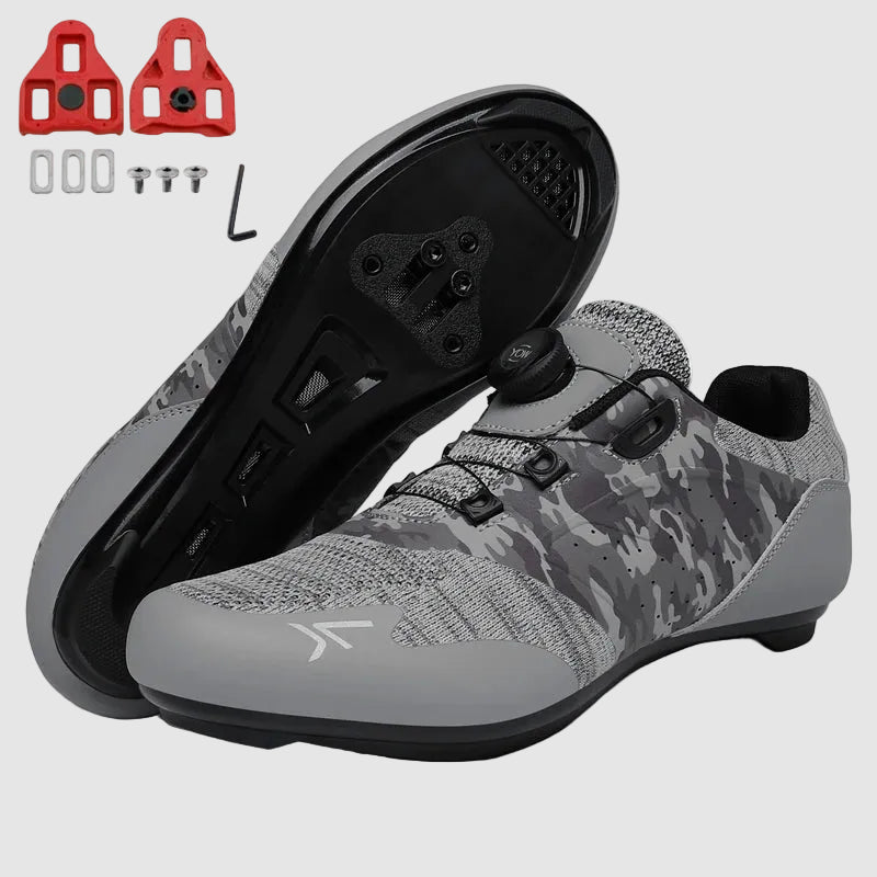 Gray camouflage cycling shoes with black cleats on a white background