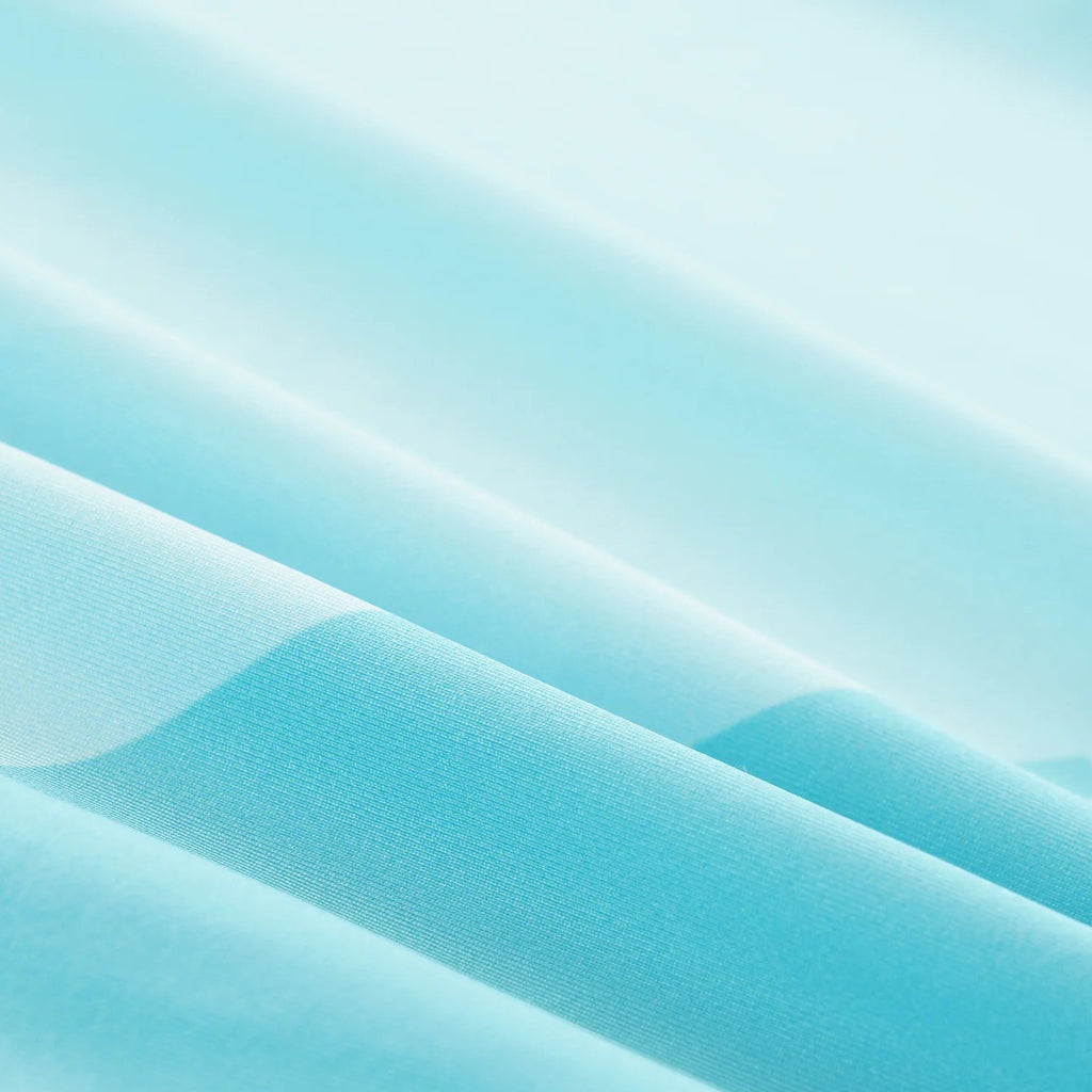 Textured blue fabric with icons and text indicating features like moisture-wicking, elasticity, lightweight, and UV 40+ on a light blue background.