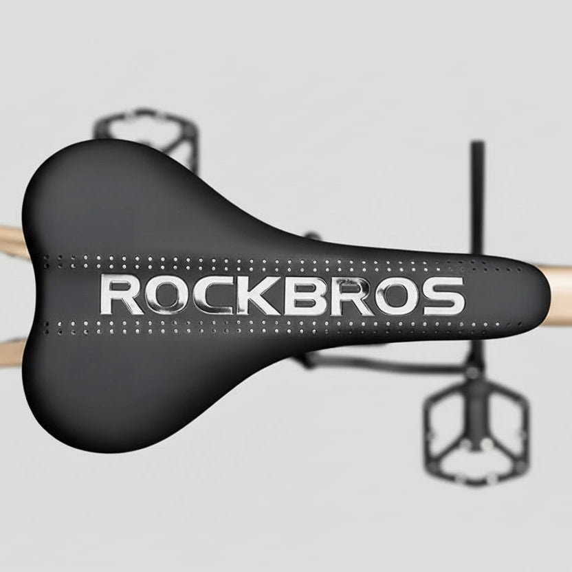 Black bicycle saddle with 'ROCKBROS' branding on a blurred background