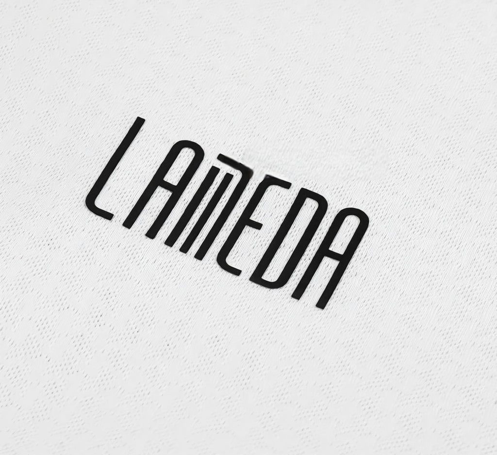 Black 'Lameda' logo on a textured white background